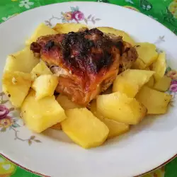 Картофи на фурна с пилешки горни бутчета